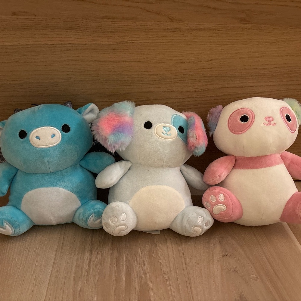 Dinosaur, dog, and panda squishmallows